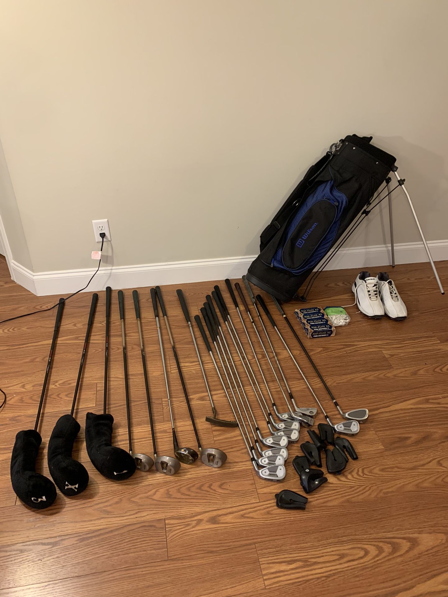 Vintage Wilson 19 golf clubs, bag, shoes, and golf balls.