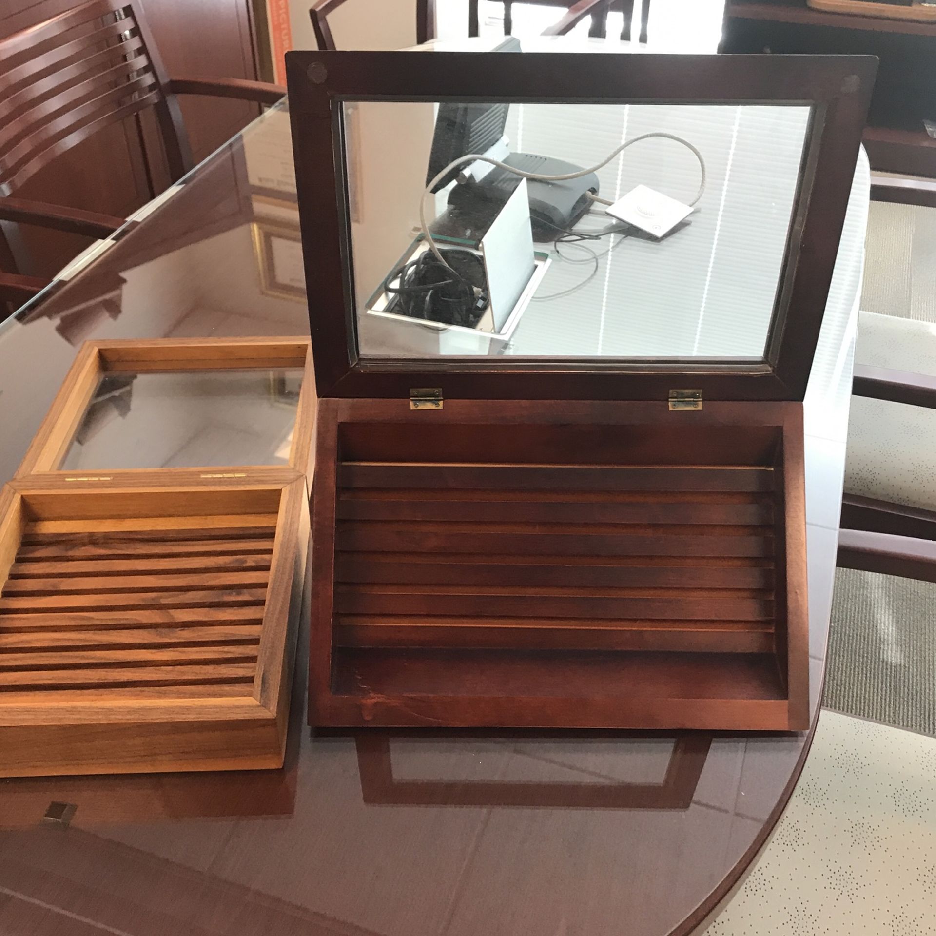 Two wooden coin boxes with glass covers