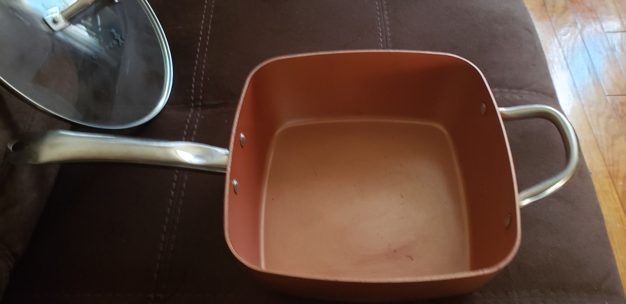 COPPER CHEF FRYING PAN ,DEEP SQUARE HOLDS 4.5 QUART PAN POT, 2 LIDS COOK OVER GAS, ELECTRIC I WOULD ALSO PUT THEM IN THE STOVE WITHOUT LIDS.