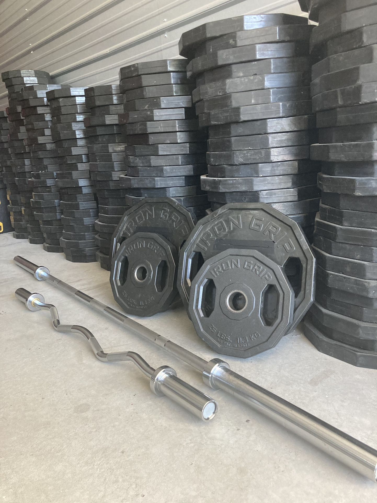 Weight Set- Olympic Bar, EZ Curl Bar, 45s, 25s & 2” Clips