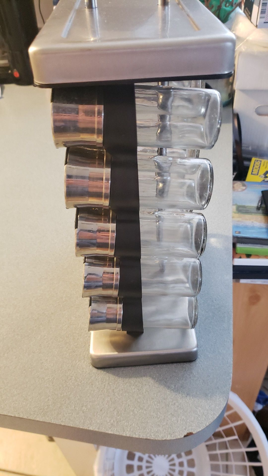 Spice rack with labeled glass jars