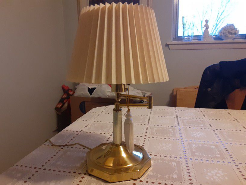  VERY NEAT LOOKING  BRASS LAMP  THAT IS  adjustable For LITE  17inches Tall 