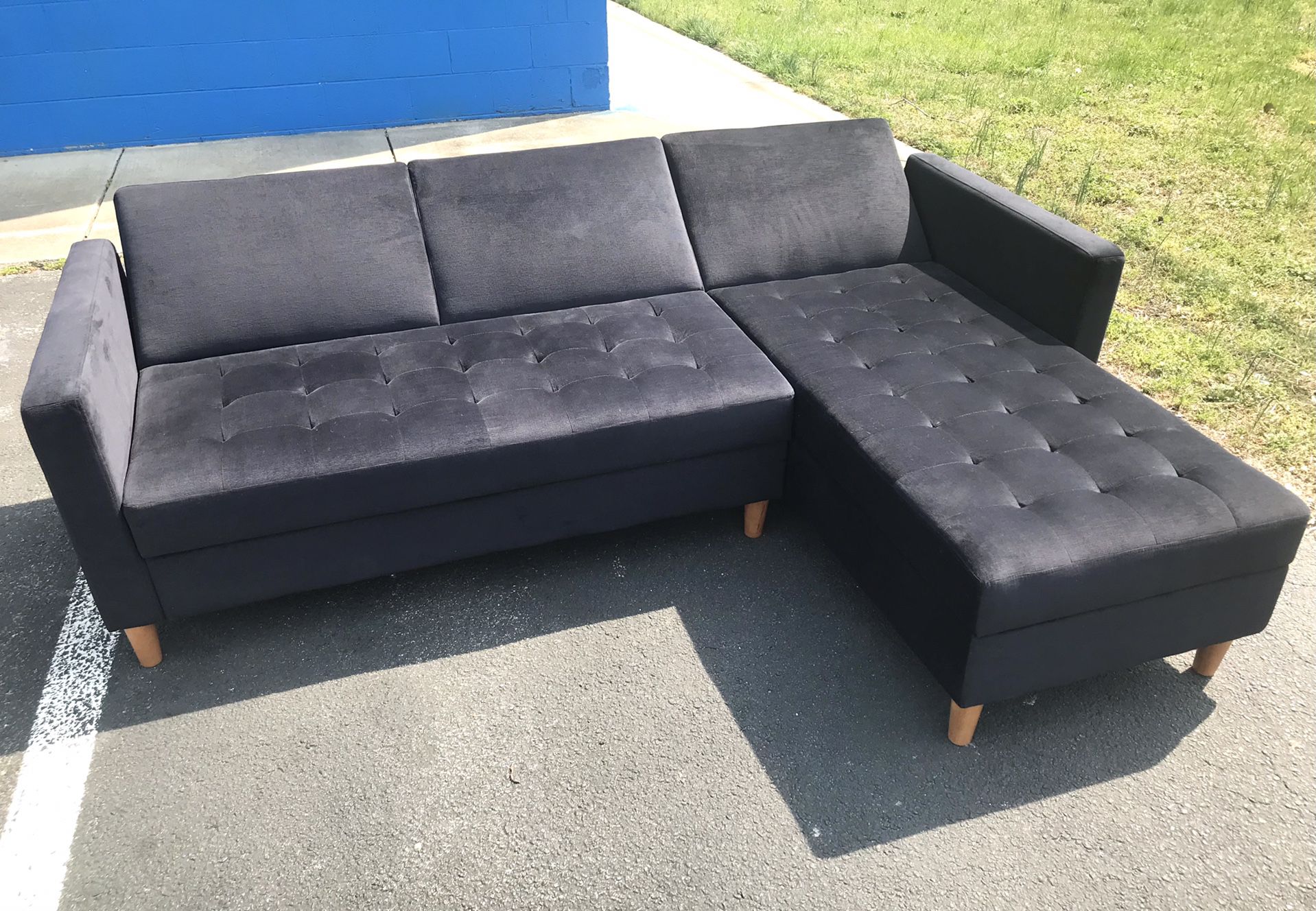 SUPER NICE! BRAND NEW BLACK VELVET SECTIONAL FUTON/ SOFA SLEEPER!! SOFT & COMFORTABLE!! RECLINES FROM SOFA TO BED!ALSO HAS STORAGE COMPARTMENT!!