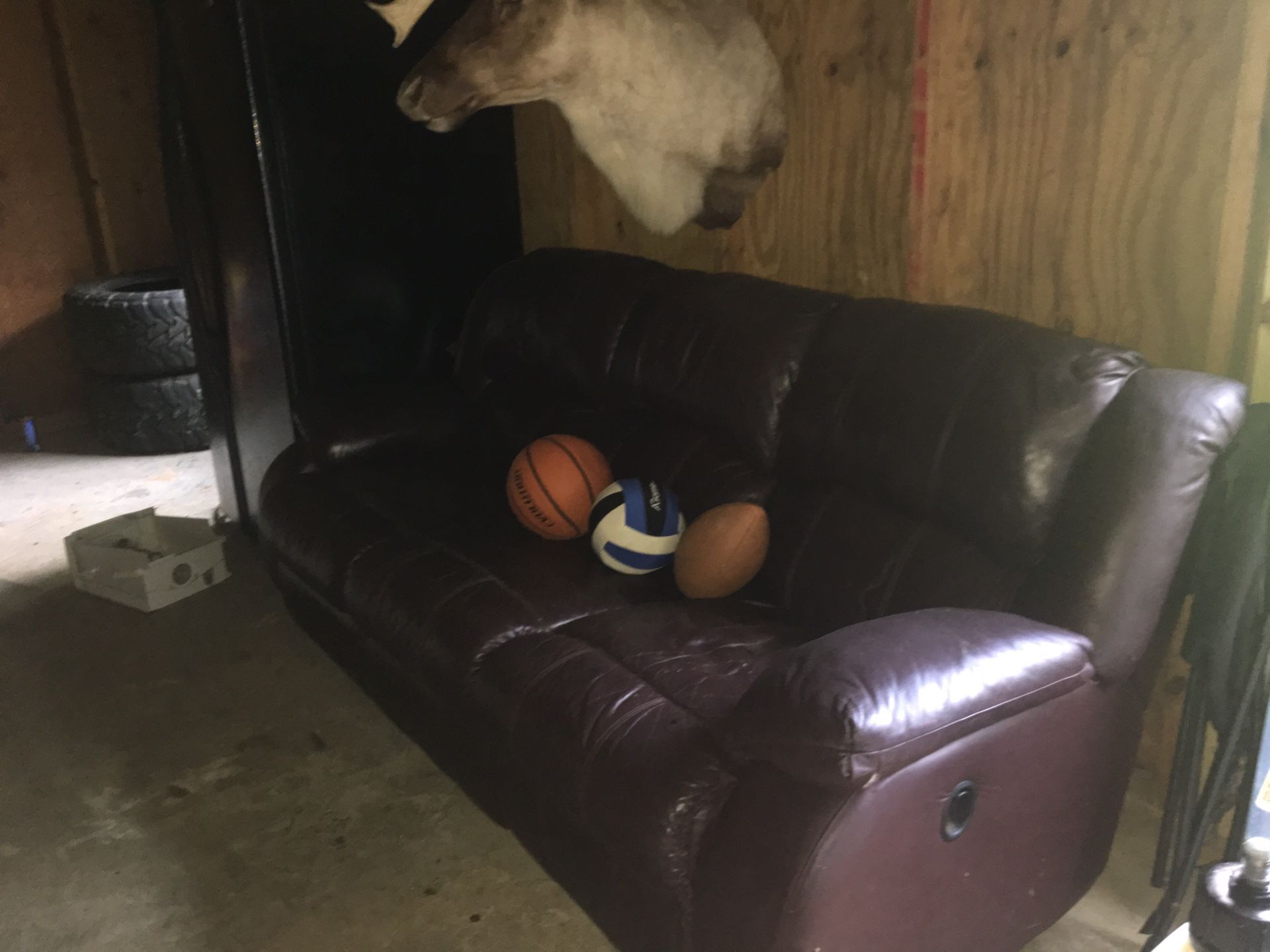 Real leather sofa with recliner on each end