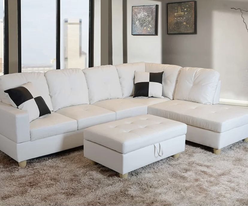 BRAND NEW WHITE LEATHER COUCH. STILL IN BOX!