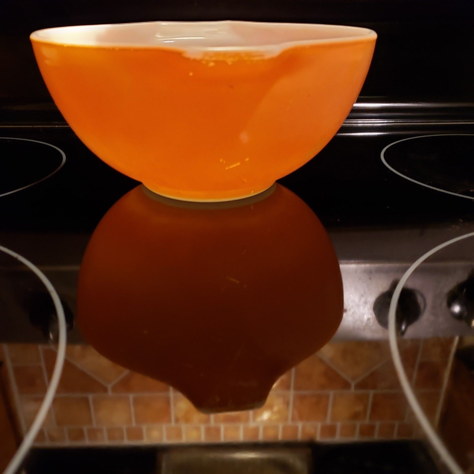 Pyrex small orange bowl..