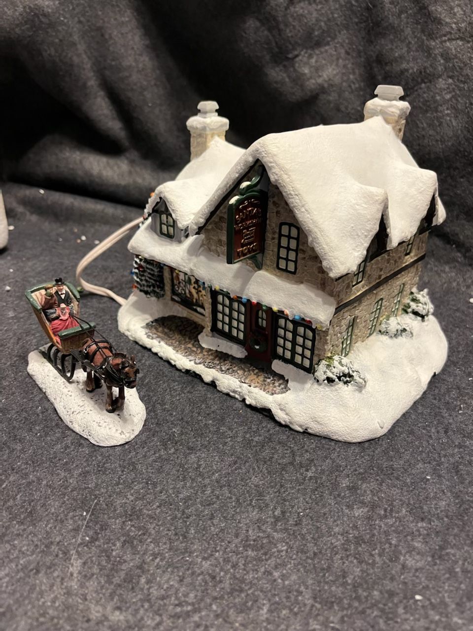 7 “Thomas Kinkade ‘s “ Village Christmas Collection , Each Come with cord that allows them to light up with switch