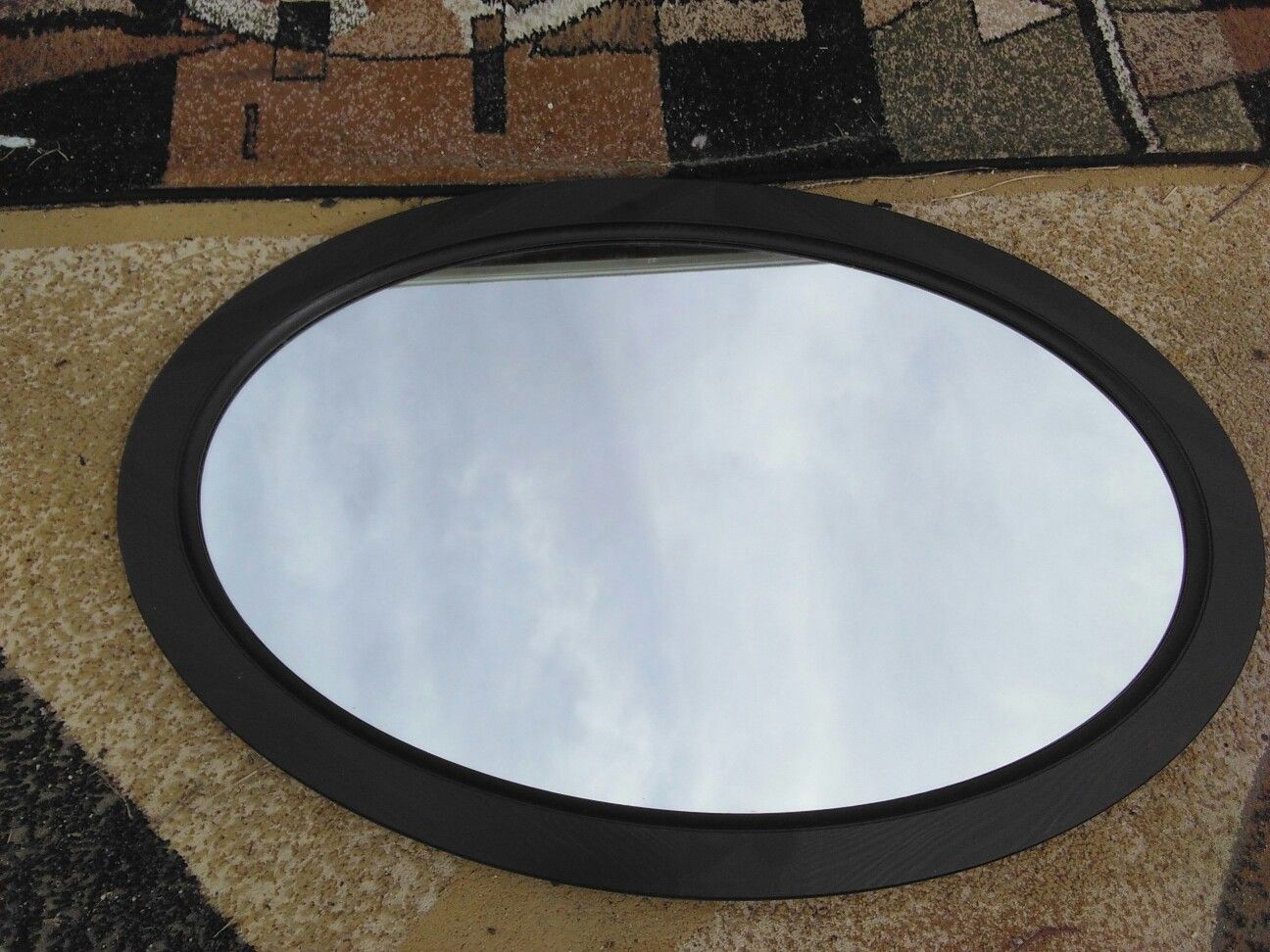 Mirror in Oval Frame.