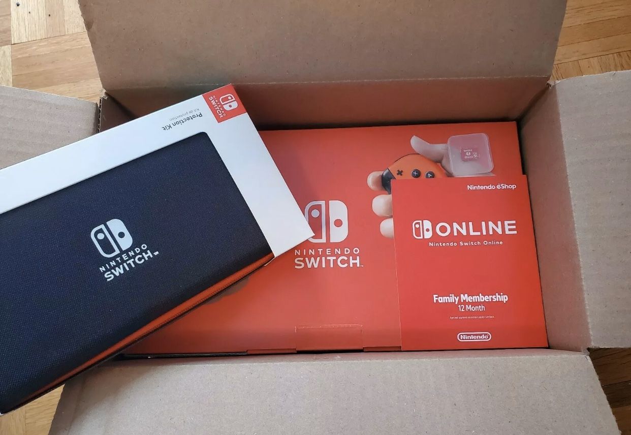 Nintendo Switch v2 NEON Costco BUNDLE+ 128gb SD Card, w/ Case, 1 year