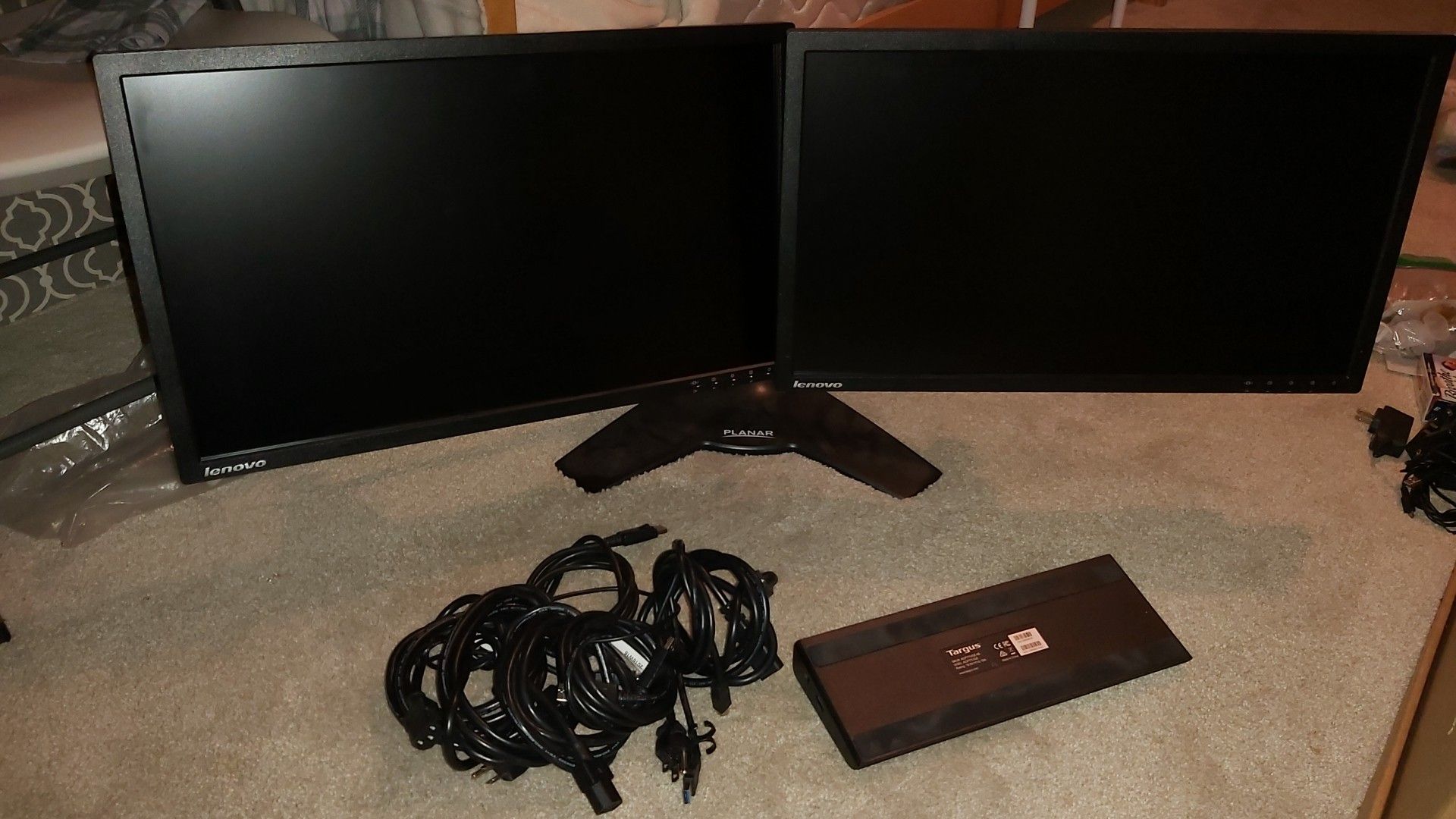 Lenovo dual monitor setup with stands and cables