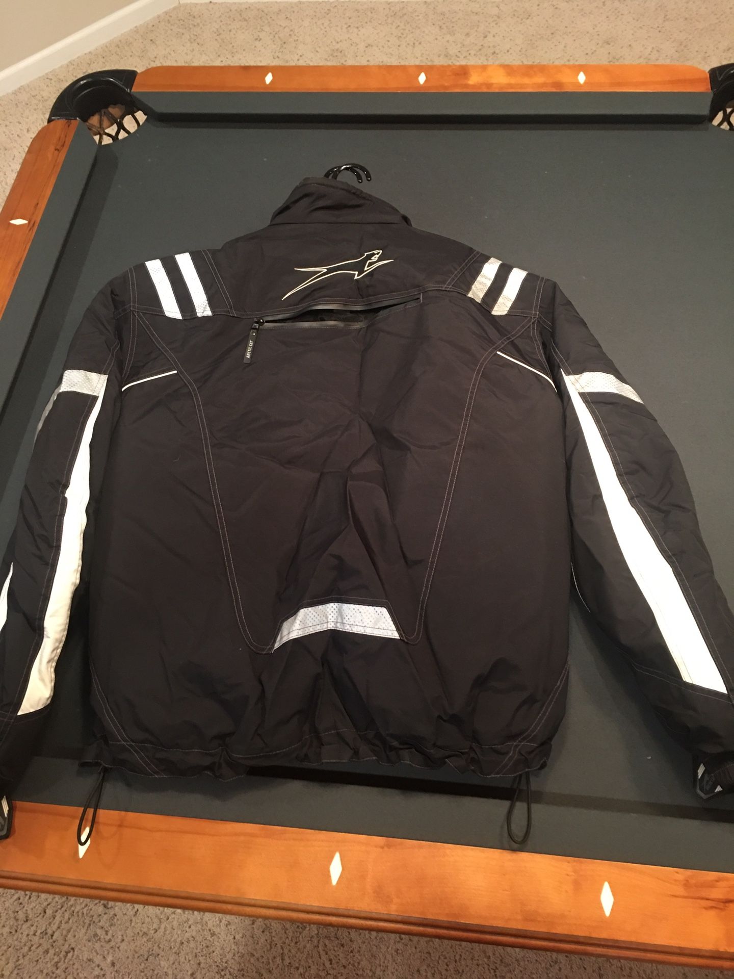 Snowmobile suite and boots and bag and gloves