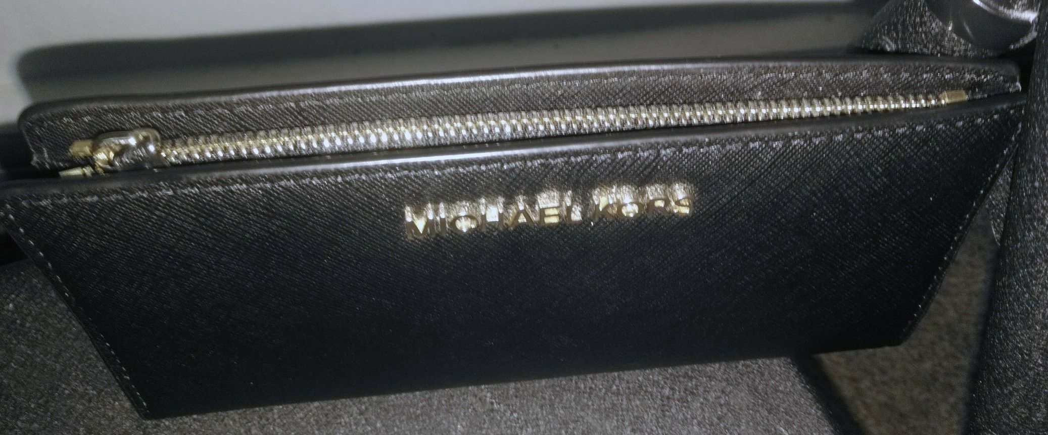 MK black and gold wallet.