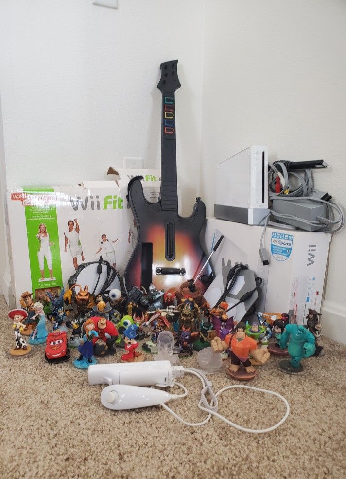 Wii with games and guitar