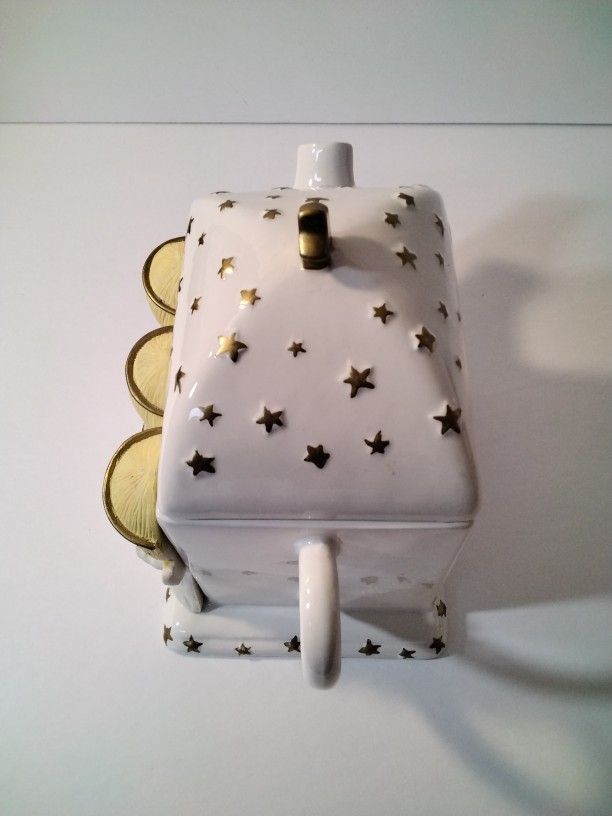 A Beautiful Tea Pot With Angels .