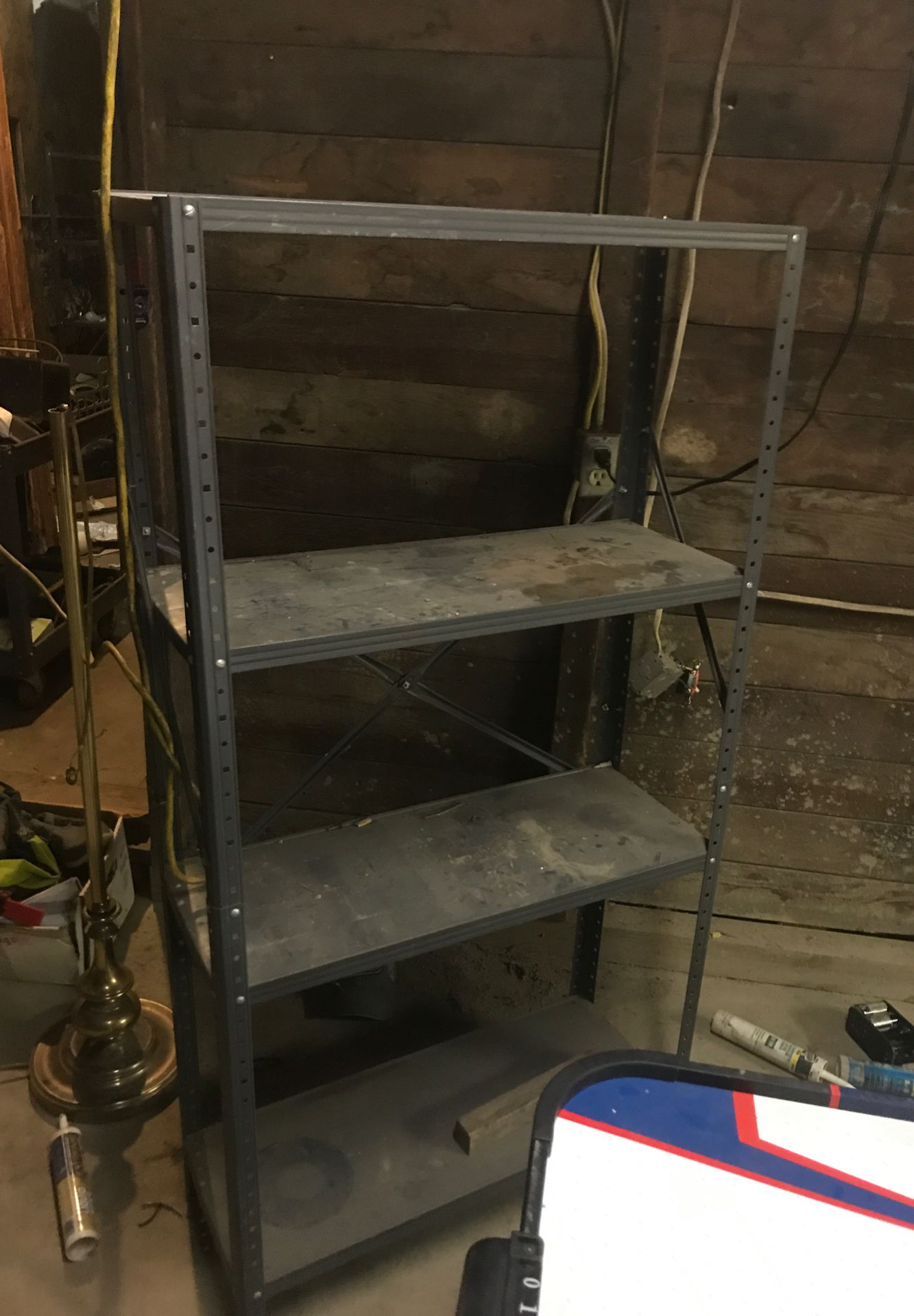 Metal shelving foot and a half 2 feet deep and about 5 feet high