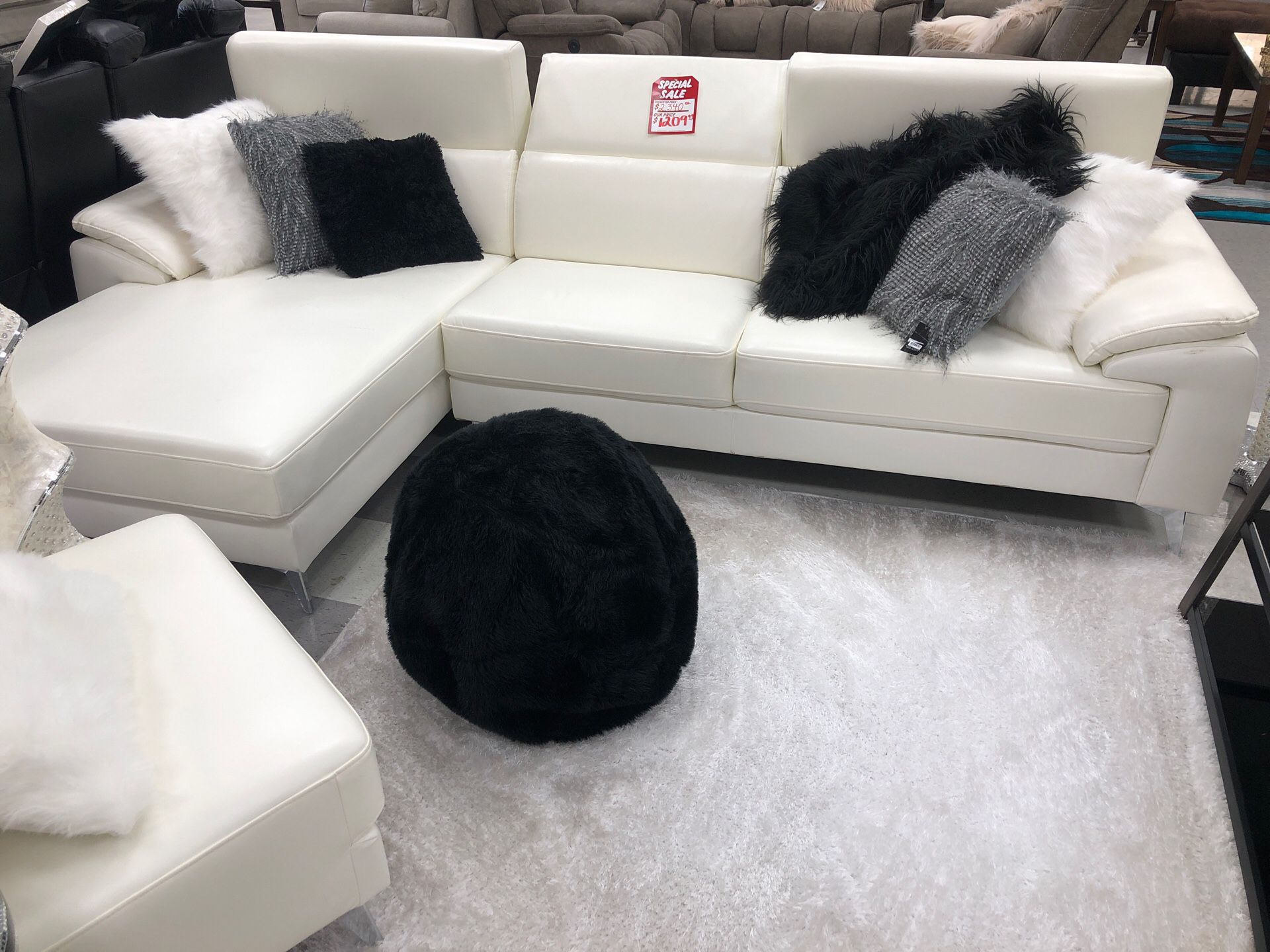 White sectional with adjustable headrest
