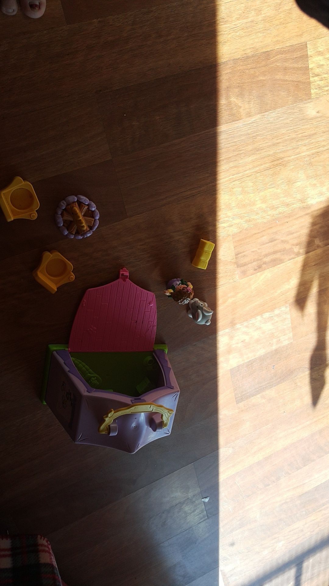 Fisher Price Little People Camping set. The door of the tent closes and the items store inside. Has a carrying handle on top.