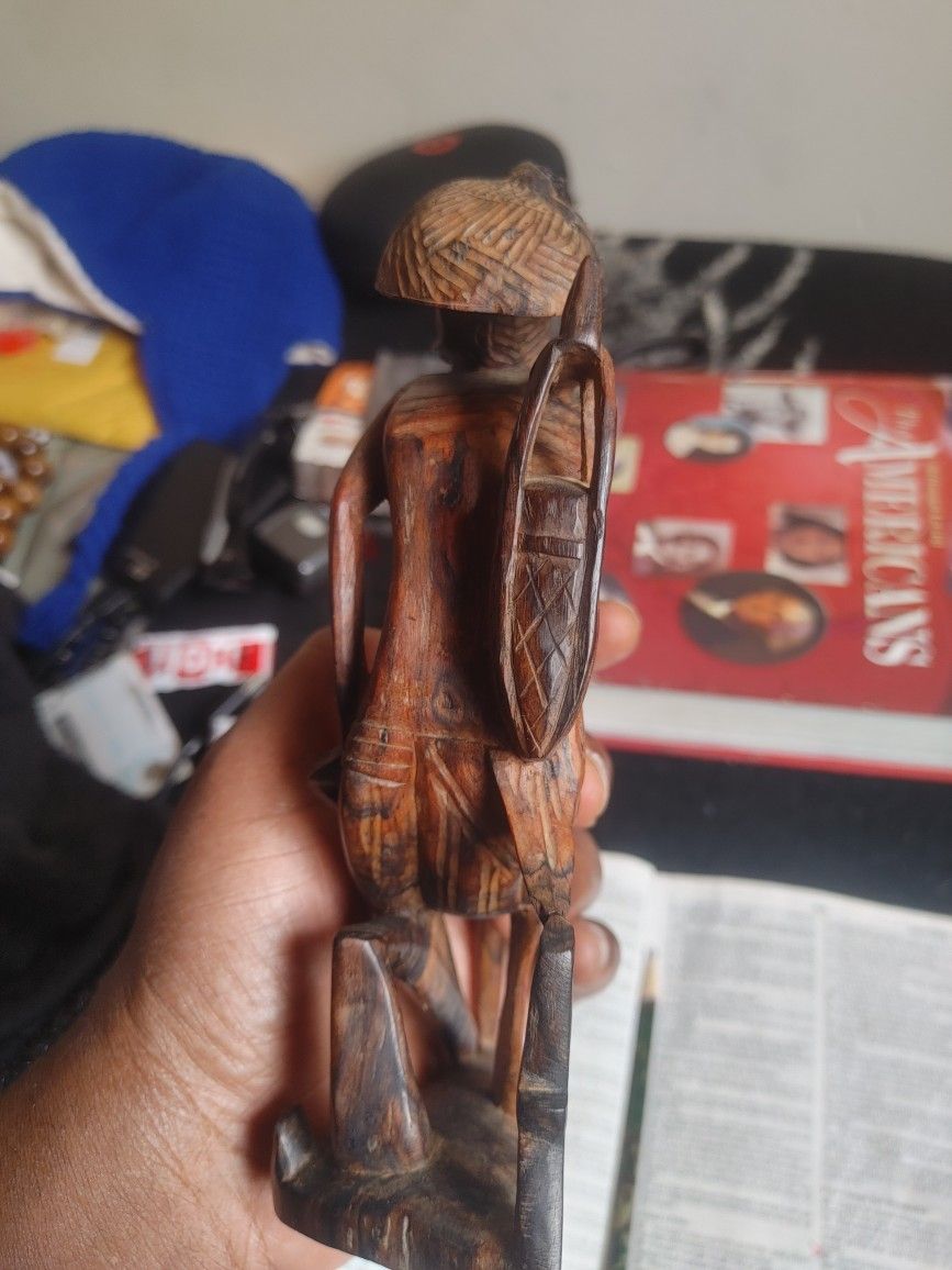 wooden statues - water carrier