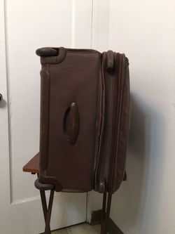 Tumi Travel Luggage  Bag with attachment of garment bag inside . Brown 26” Two Wheeled . Dimension 14x20x26.  Perfect and excellent condition and only Thumbnail