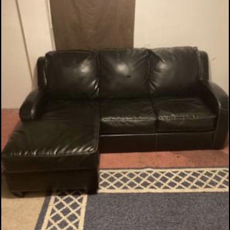 black leather sleeper ottoman sofa Folds Out To A Bed