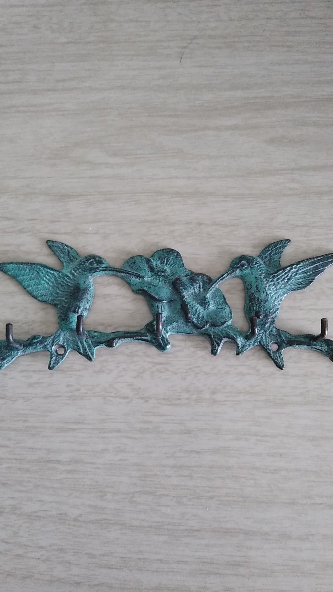 Metal wall decor with hooks