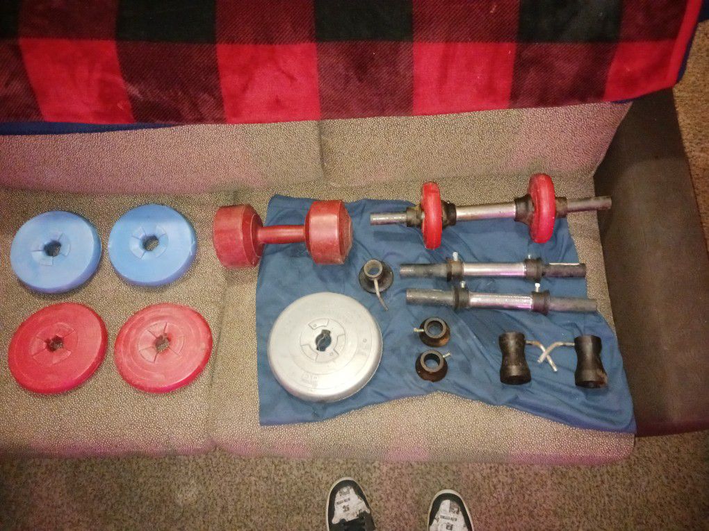 Free Weights And Bars And Clamps 5 Pounders A 8.8 Pounder And A 10 Pounder