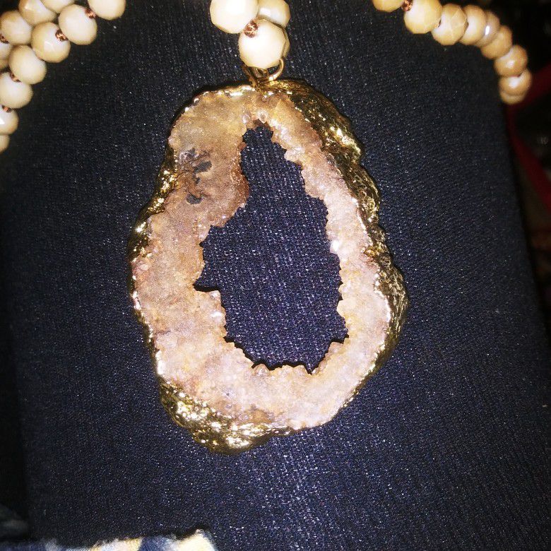 Geode pendant with heavy gold chain