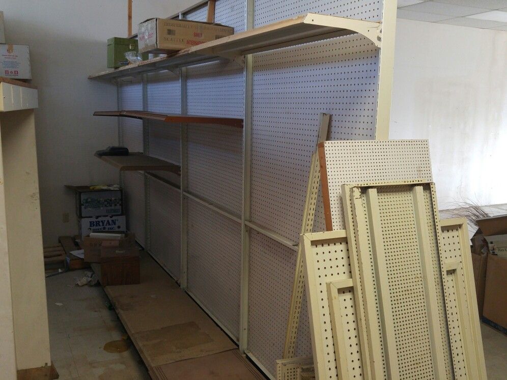 Metal Shelving With Pegboard And A Few Shelves