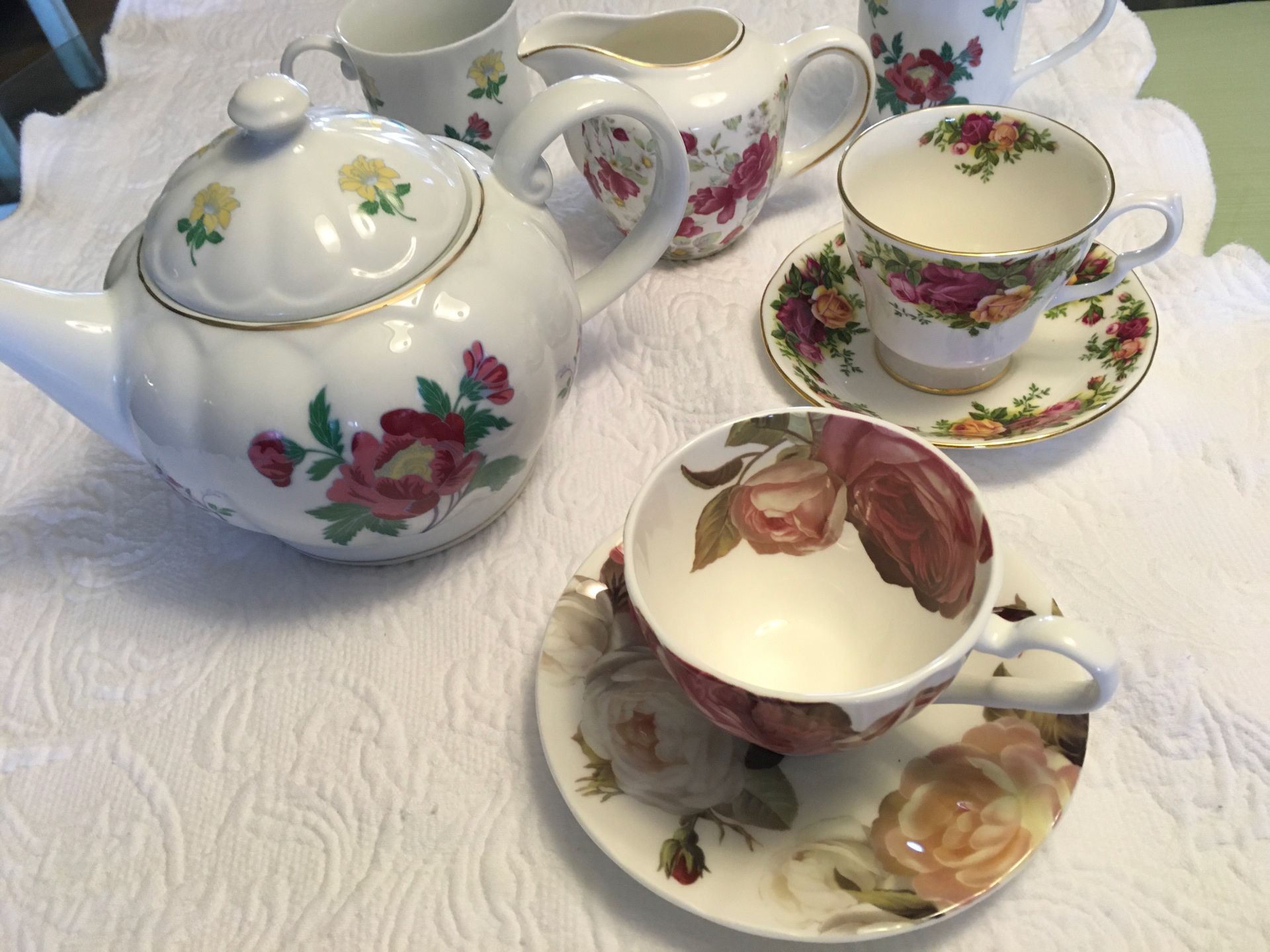Laura Ashley China tea pot and assorted teacup and sauces ,and creamer