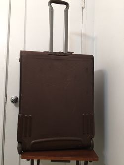 Tumi Travel Luggage  Bag with attachment of garment bag inside . Brown 26” Two Wheeled . Dimension 14x20x26.  Perfect and excellent condition and only Thumbnail