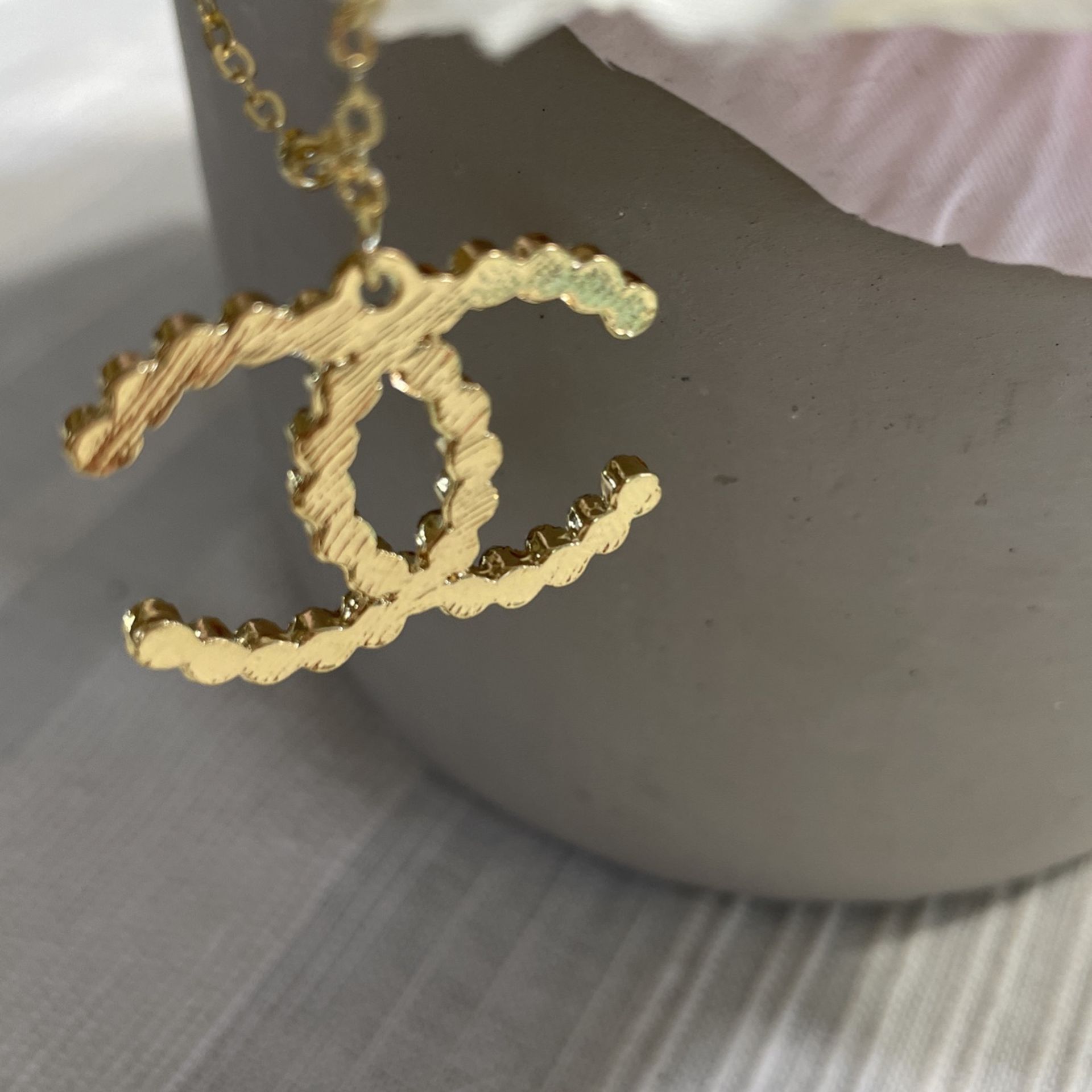 Fashion CC Gold tone necklace approximate length 13 inches