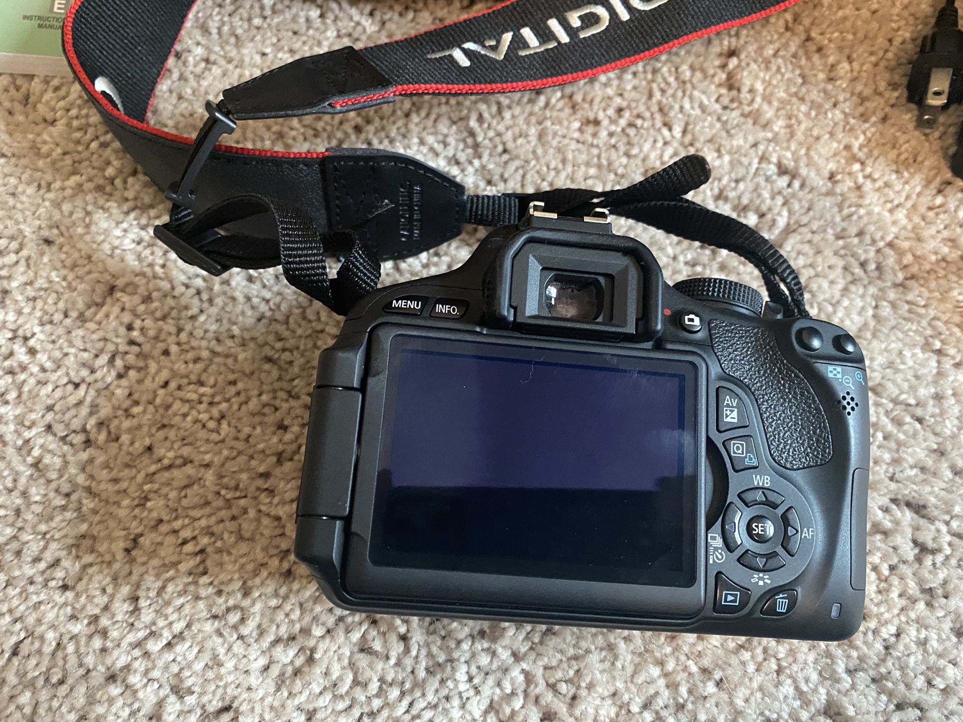 Excellent condition Canon EOS Rebel camera with two lenses, battery charger, and large camera bag.