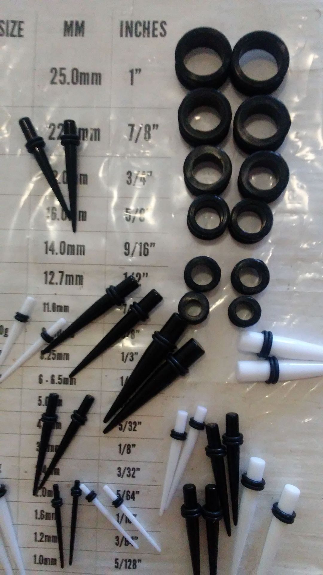 Tapers gauges and body jewelry of all sorts something dollars some three dollars some five dollars