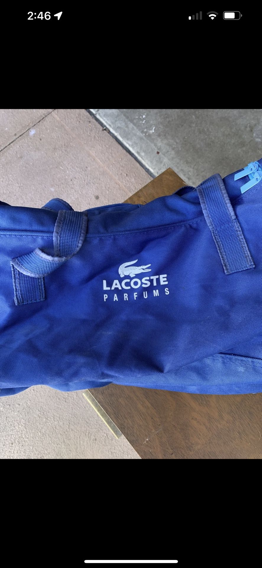 Blue Lacoste duffel bag