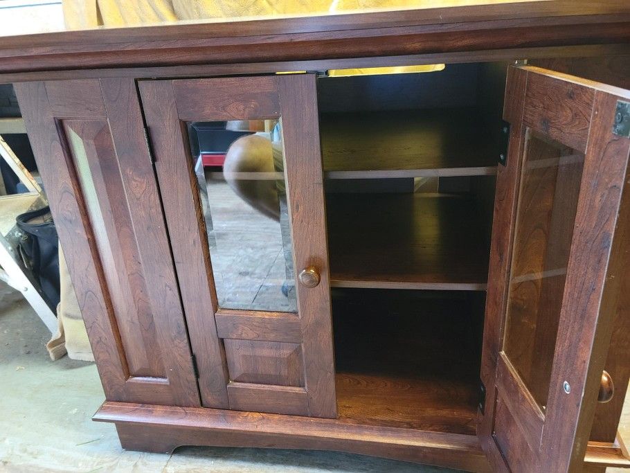 This beautiful well constructed heavy piece of furniture can be used as a entertainment center, TV stand, console table, etc.