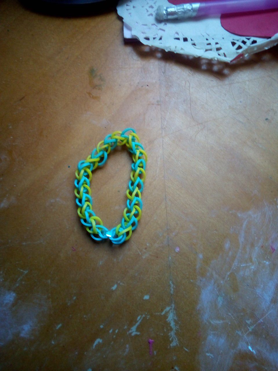 A yellow and blue rainbow loom bracelet for kids or teenagers handmade