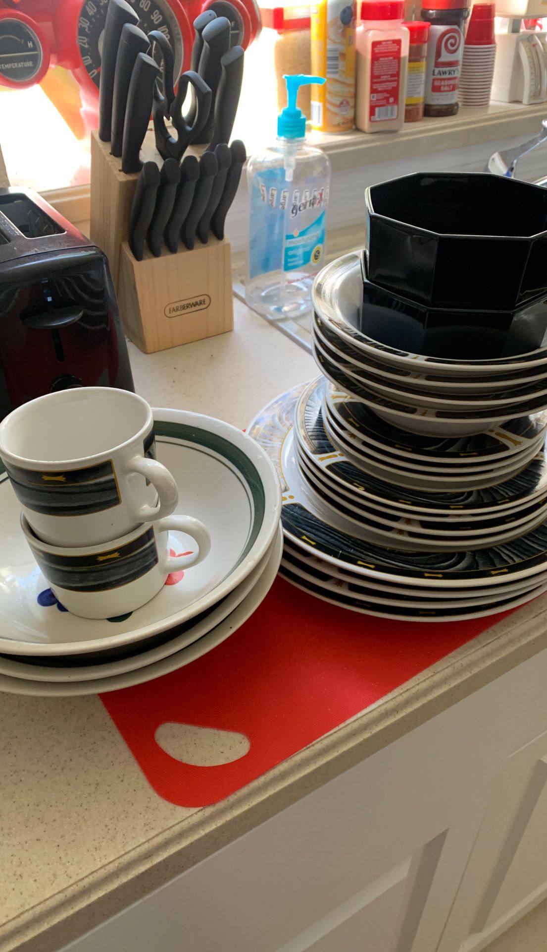 Two coffee cups two small bowls for medium bowls three large bowls three small plates four medium plates and four large plates