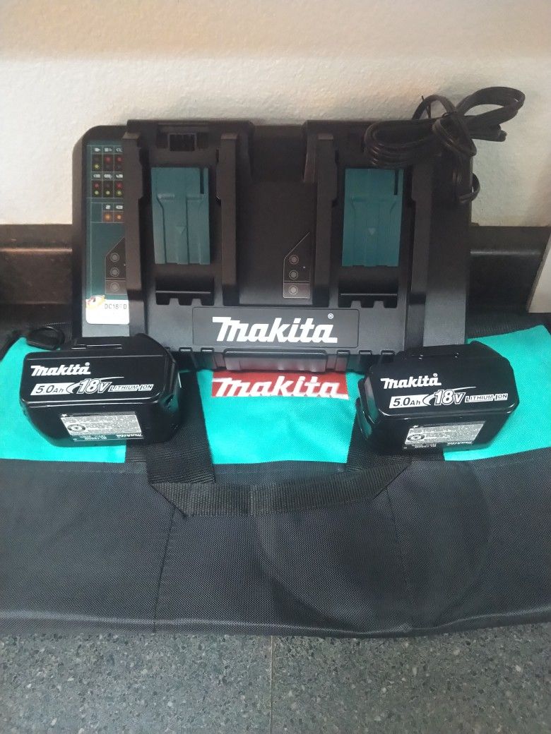 Brand New Makita Dual Port Charger +2-5ah 18 Volt Batteries And Heavy Duty 22x11 Makita Contractor Bag $150 Firm