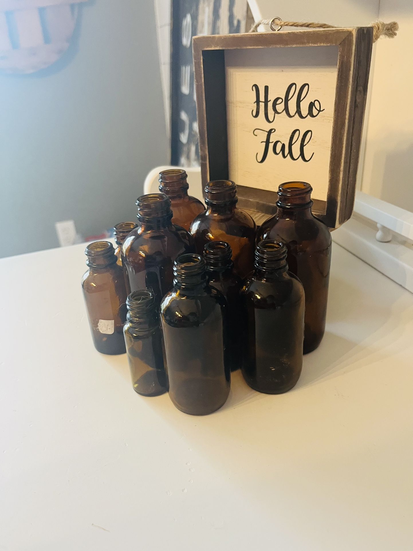 Small Amber Bottles And Small Sign