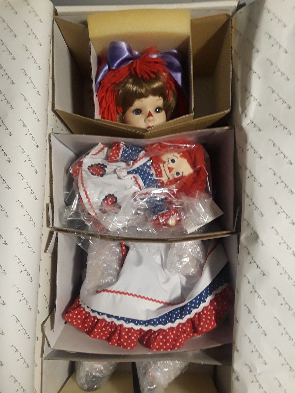 Raggedy ann & andy porcelain dolls