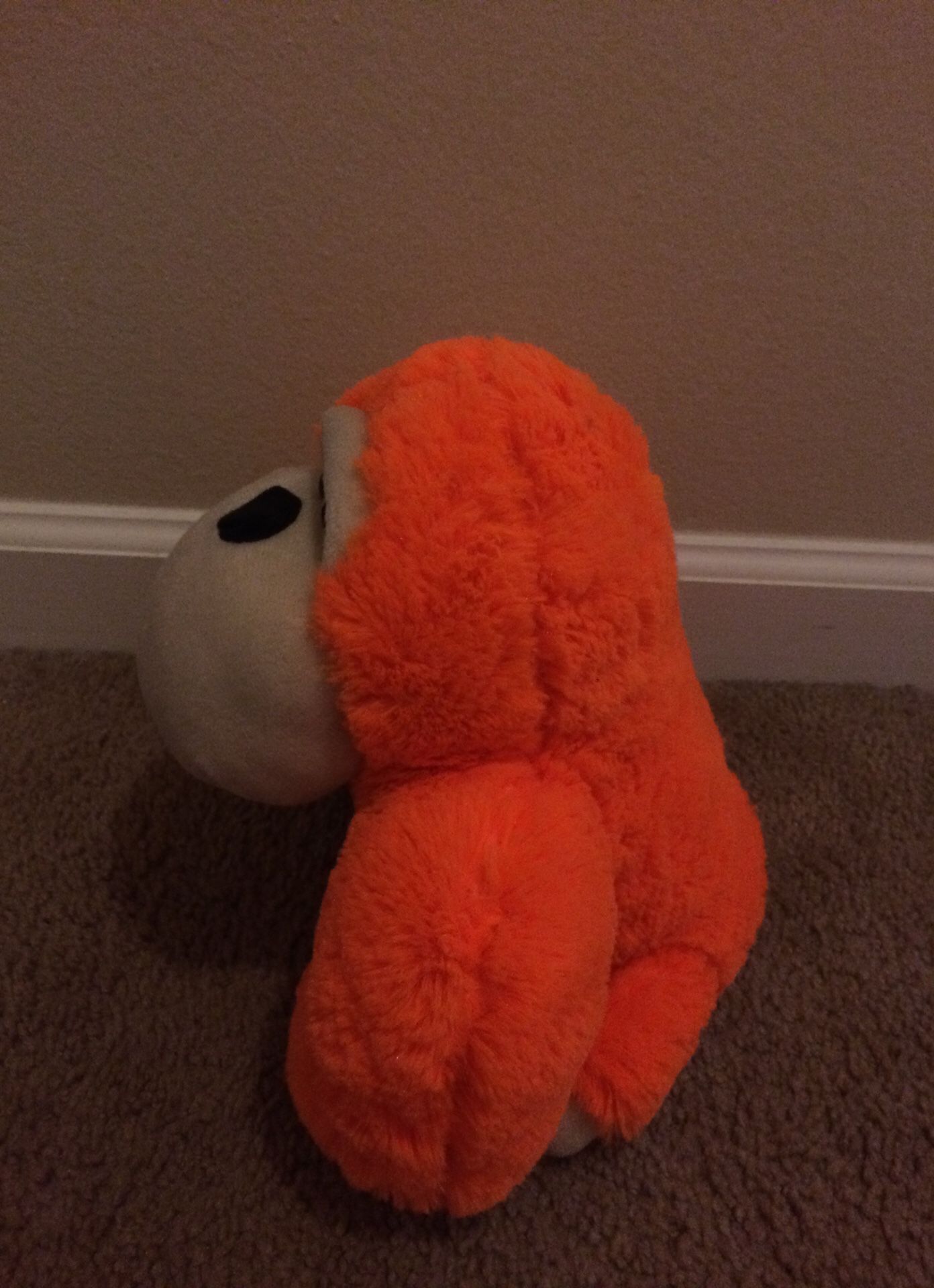 Orange monkey stuffed animal toy