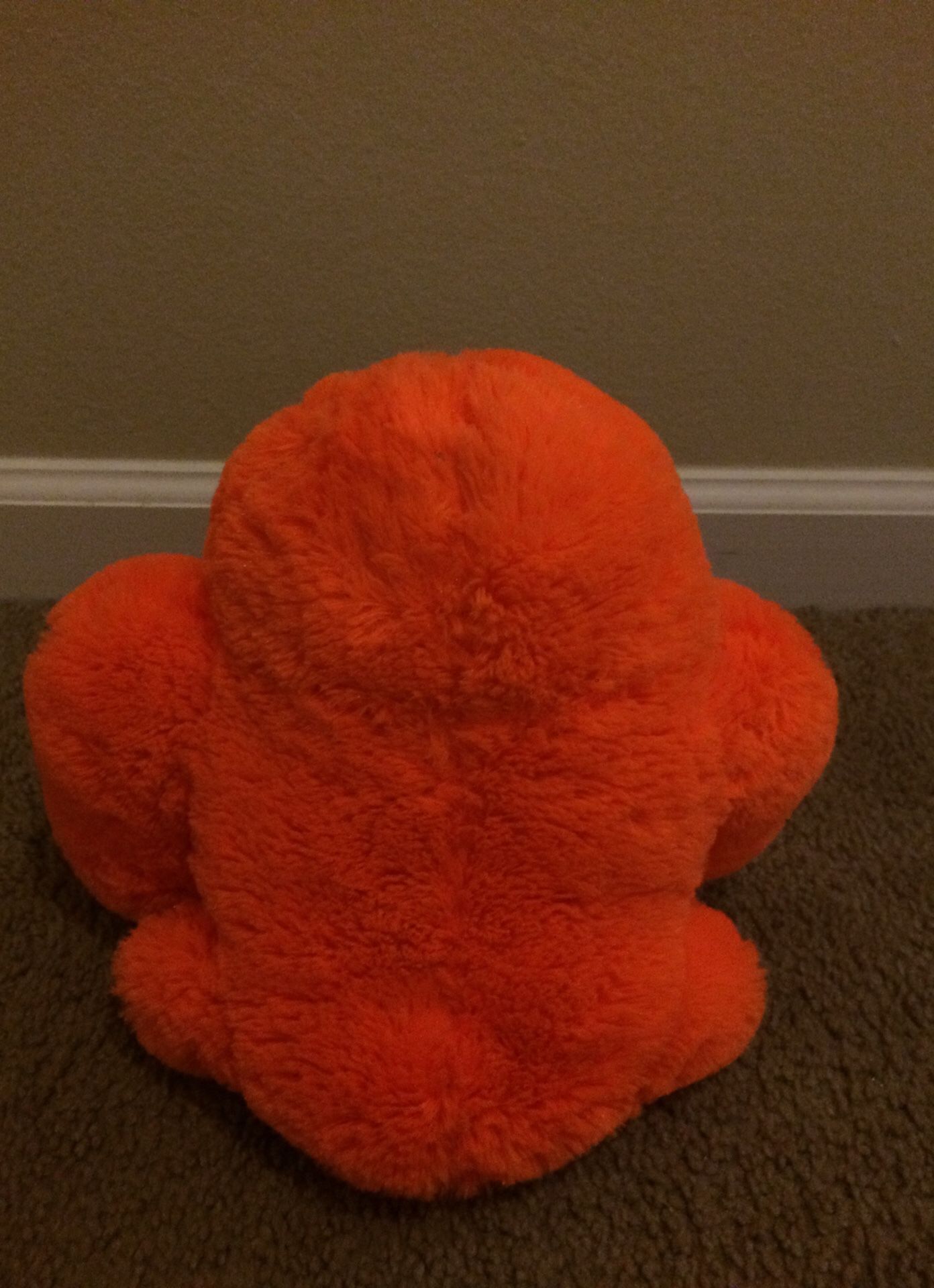Orange monkey stuffed animal toy